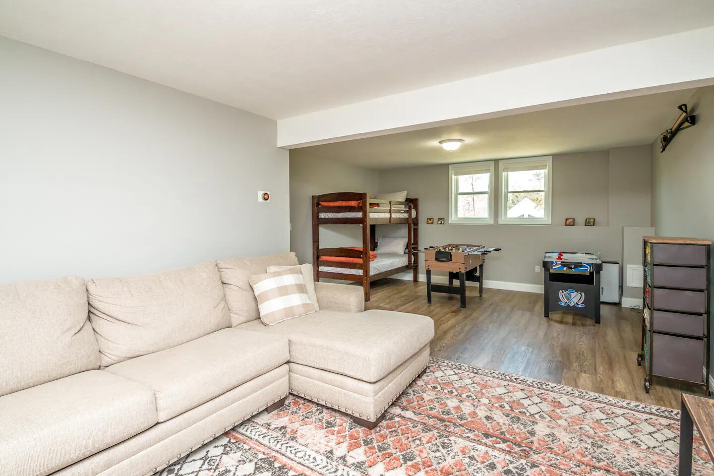 Cozy twin bedroom with new mattresses, pillows, mattress covers and bedding. Flat screen tv on wall. Closet across hall with dresser inside and room for hanging clothes. Plenty of wall hooks and storage chest for your clothes. Window AC in Summer.